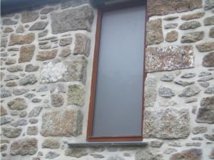 Lime pointed window in Cornish granite.